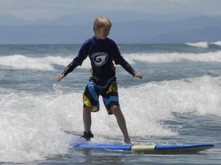 Surfing at Ohope Beach